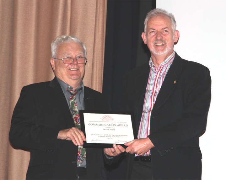 Stuart receiving Hallmark Society Communications Award from Ken Johnson, President